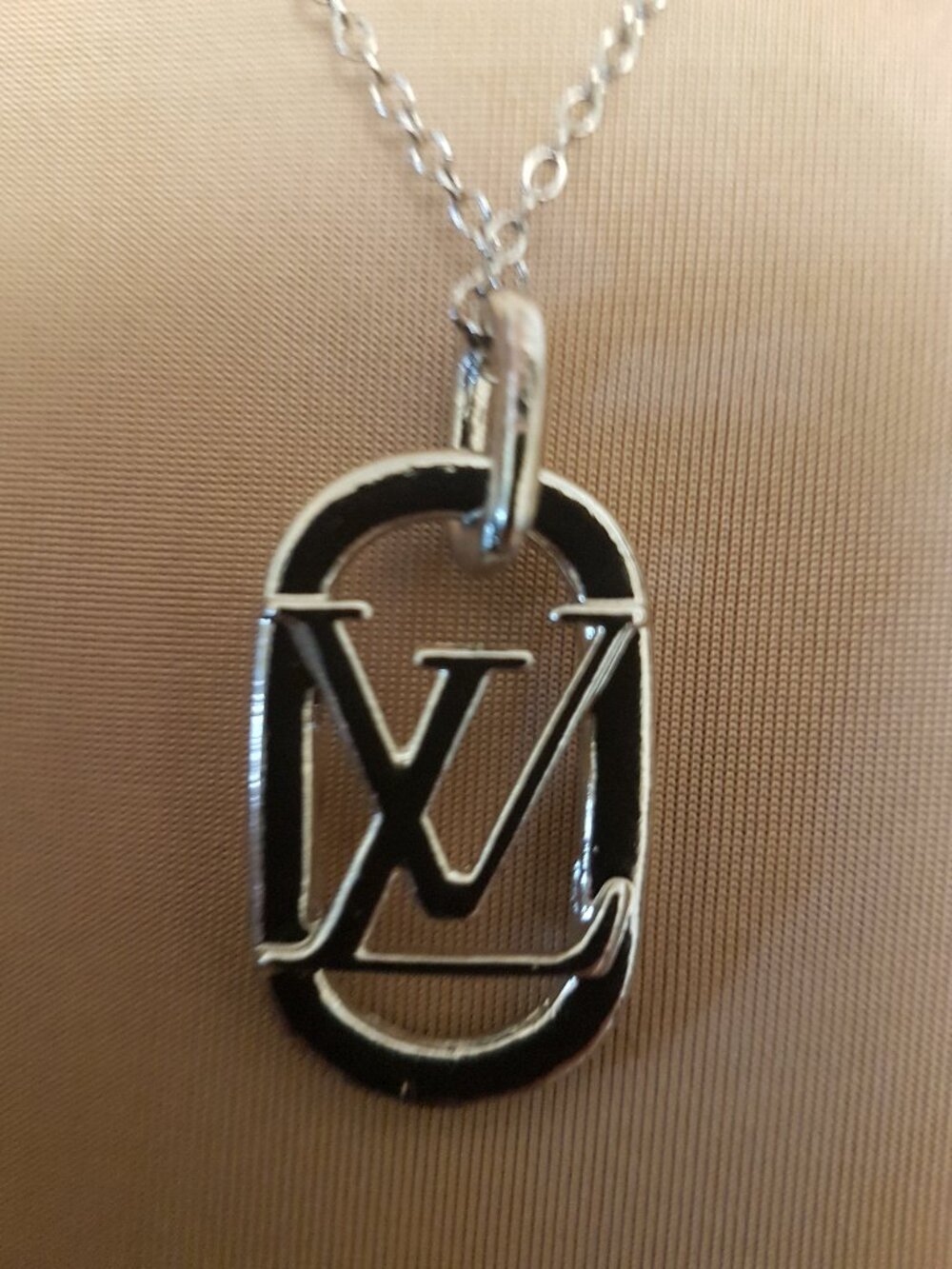 Silver tone charm necklace with  iconic initial